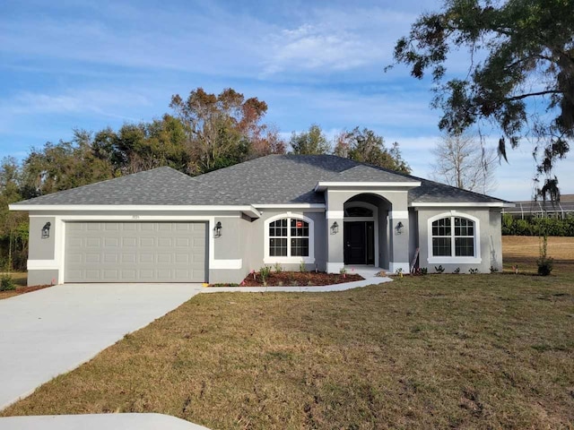 ranch-style home featuring a front yard and a garage