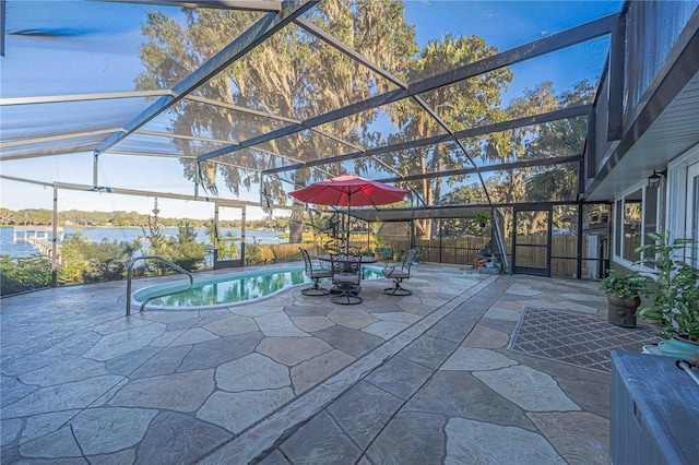 view of patio with glass enclosure, a water view, and a fenced in pool