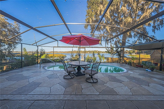 view of patio featuring a fenced in pool, glass enclosure, and a water view