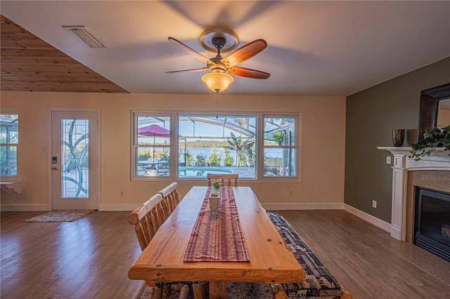 unfurnished dining area with ceiling fan and hardwood / wood-style floors