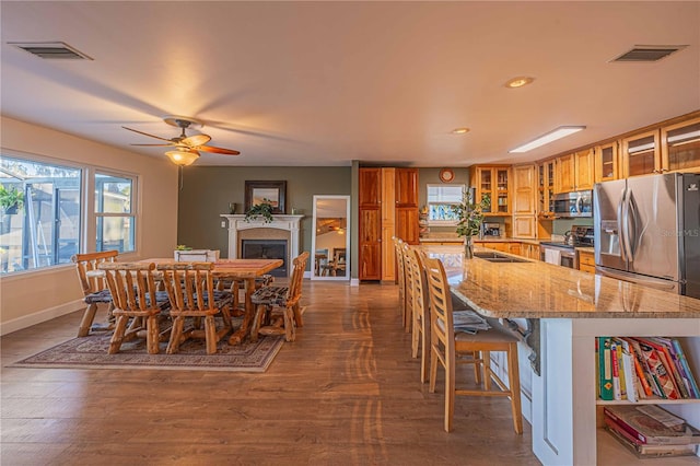 dining area featuring dark hardwood / wood-style floors and ceiling fan