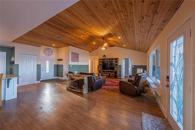 living room with hardwood / wood-style floors, vaulted ceiling, ceiling fan, and wood ceiling