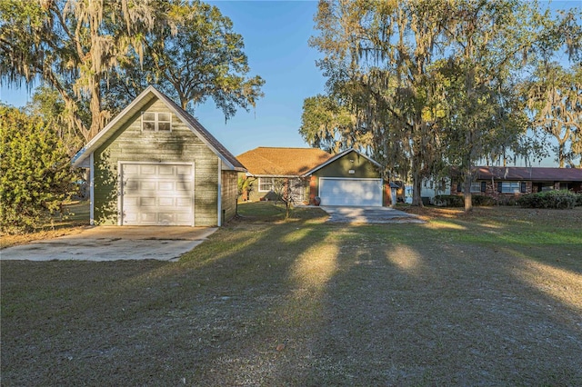 single story home with a garage and a front lawn