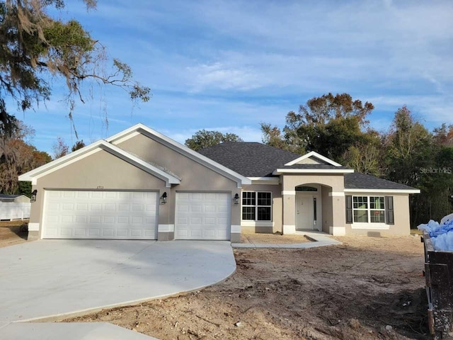 ranch-style home with a garage