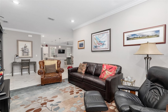 living room featuring crown molding