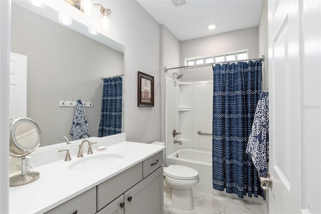 full bathroom featuring vanity, toilet, and shower / tub combo with curtain