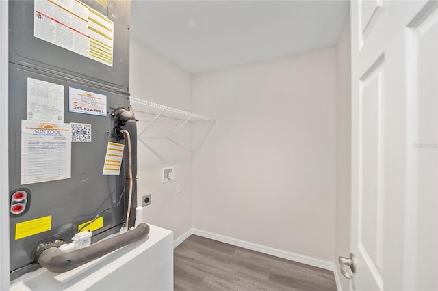 utility room featuring heating unit