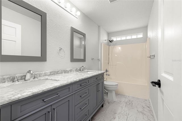 full bathroom with vanity, toilet, a textured ceiling, and bathing tub / shower combination