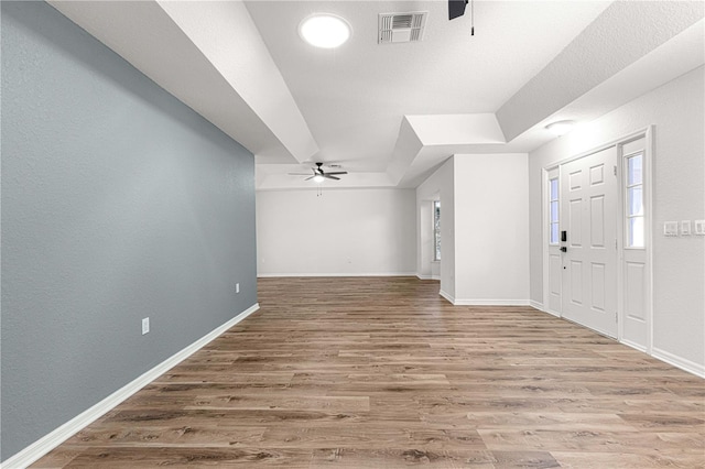 foyer entrance featuring ceiling fan and hardwood / wood-style flooring