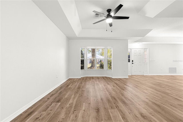 unfurnished living room with hardwood / wood-style floors and ceiling fan