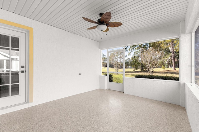 unfurnished sunroom with ceiling fan and wooden ceiling