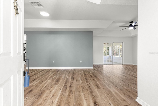 interior space with light hardwood / wood-style floors and ceiling fan