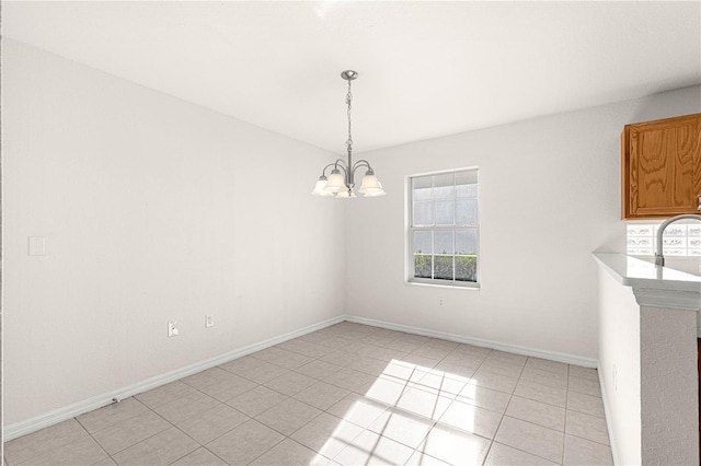 unfurnished dining area with light tile patterned floors and an inviting chandelier