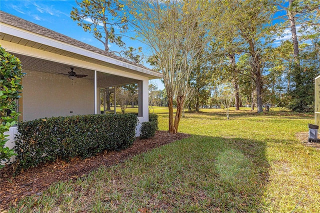 view of yard featuring ceiling fan