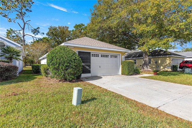 exterior space with a garage and a front lawn