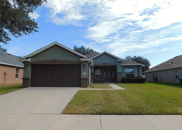 view of front facade with a front lawn and a garage