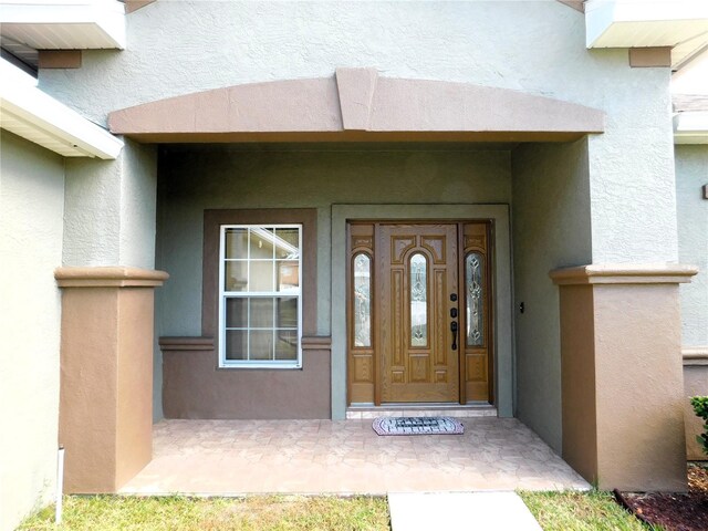 property entrance with covered porch