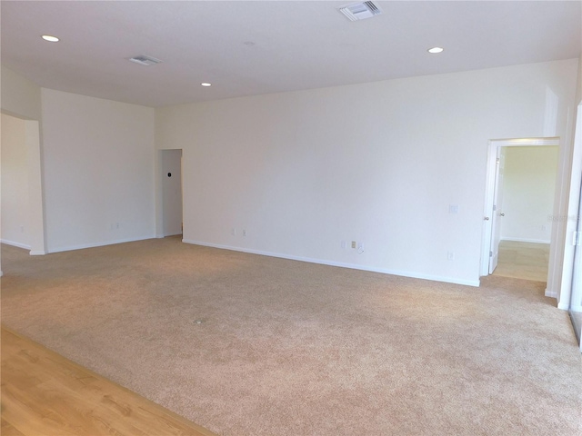 empty room with light colored carpet