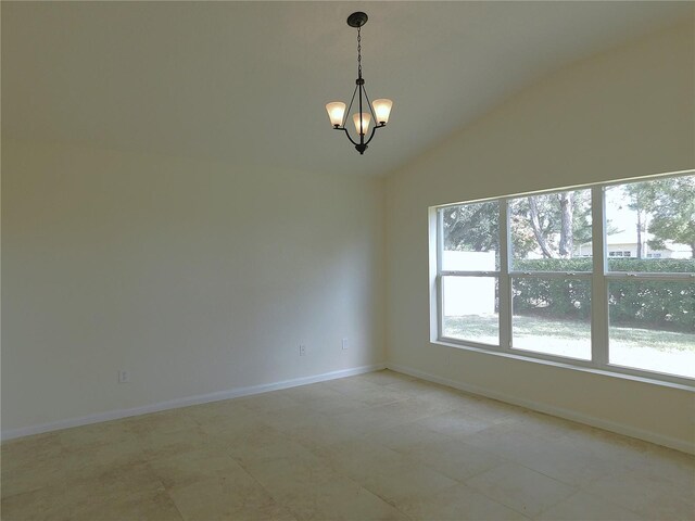 unfurnished room with lofted ceiling and an inviting chandelier