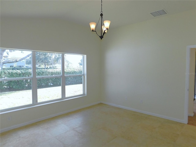 unfurnished room featuring a chandelier and lofted ceiling