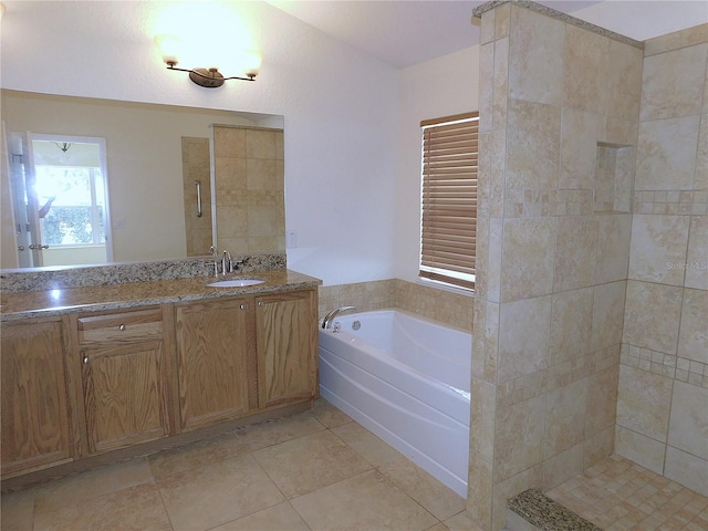 bathroom with tile patterned flooring, vanity, and independent shower and bath