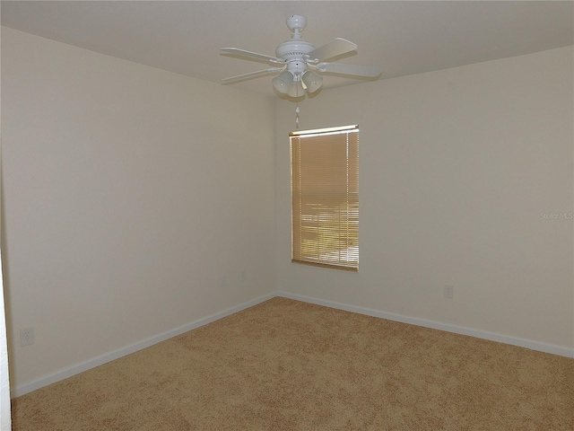 unfurnished room with ceiling fan and carpet floors