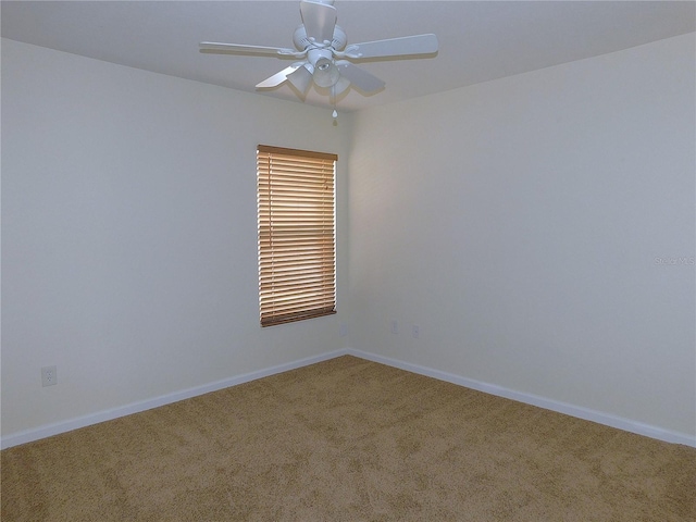 carpeted empty room with ceiling fan