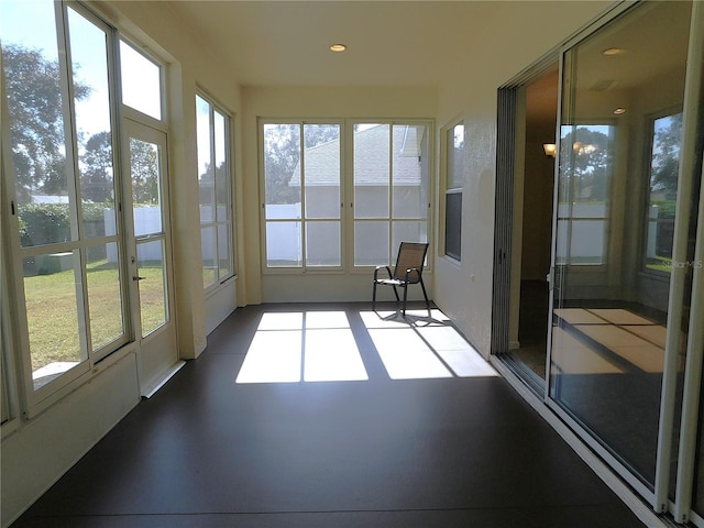 unfurnished sunroom featuring an inviting chandelier