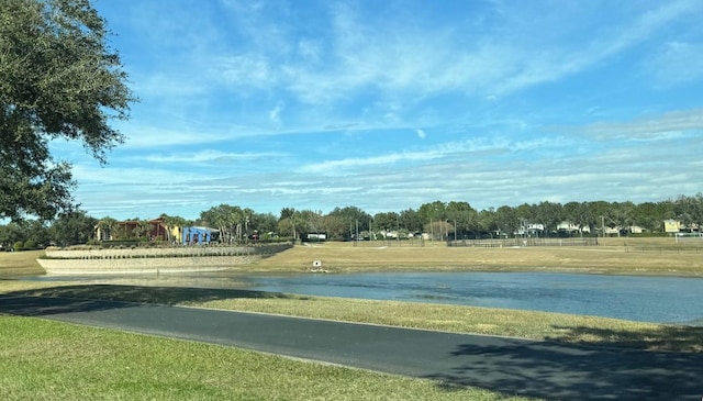 surrounding community featuring a water view