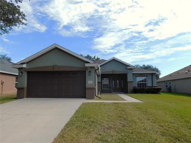 ranch-style home featuring central AC, a garage, and a front lawn