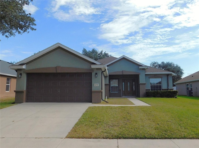 view of front facade featuring a garage and a front yard