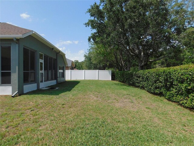 view of yard with fence