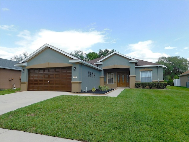 single story home featuring concrete driveway, a front yard, stucco siding, and a garage
