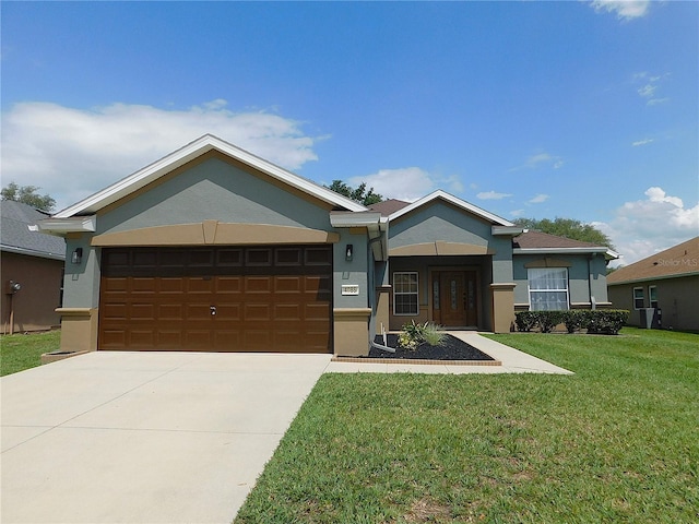 single story home with concrete driveway, a front yard, stucco siding, and a garage