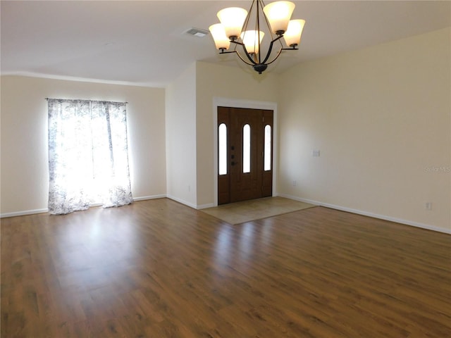 entryway with an inviting chandelier, visible vents, plenty of natural light, and wood finished floors