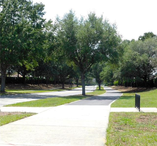 surrounding community with a yard