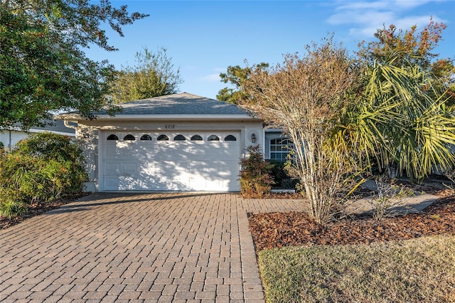 ranch-style house featuring a garage