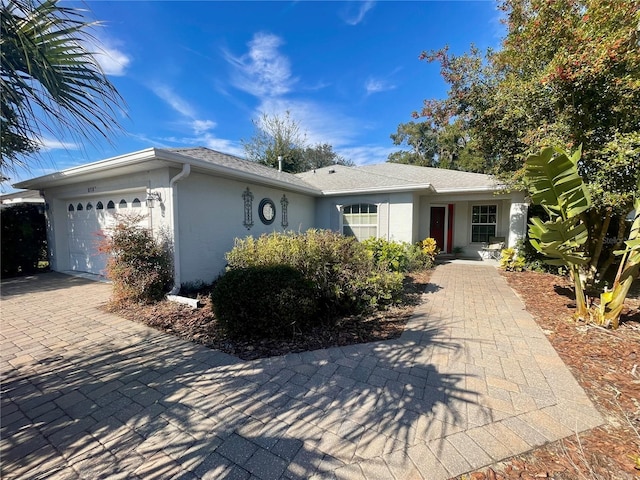 single story home featuring a garage