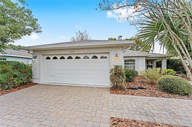 single story home featuring a garage