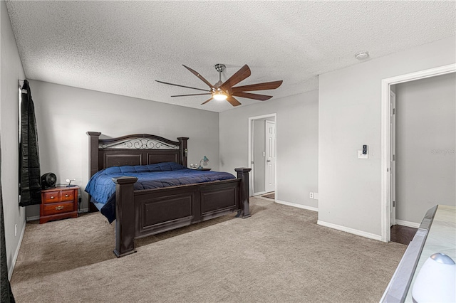 carpeted bedroom with a textured ceiling and ceiling fan