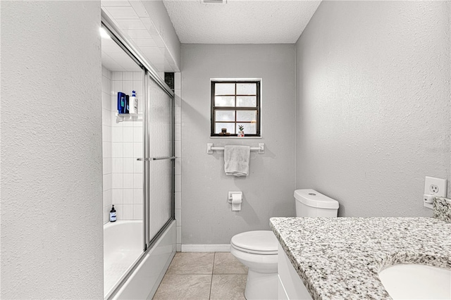 full bathroom with enclosed tub / shower combo, tile patterned floors, a textured ceiling, toilet, and vanity