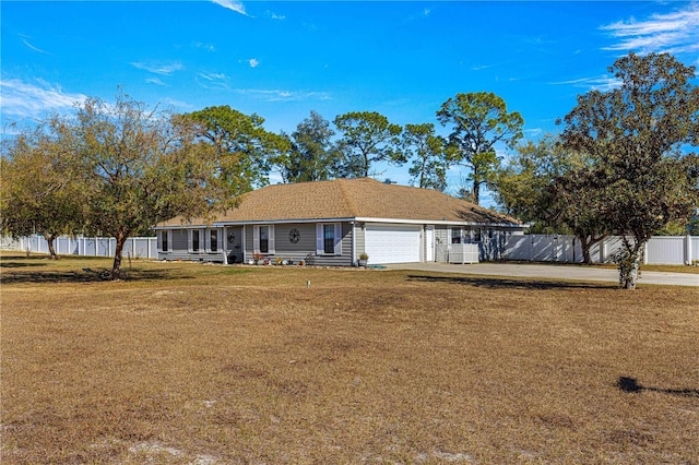 ranch-style house with a front lawn and a garage