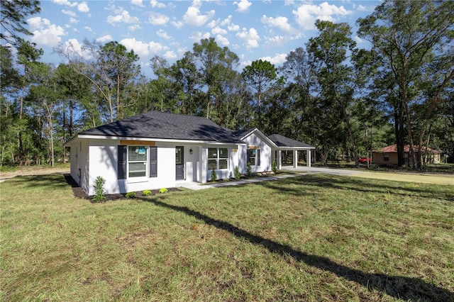 single story home featuring a front lawn and a carport