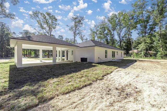 back of property with a patio and cooling unit