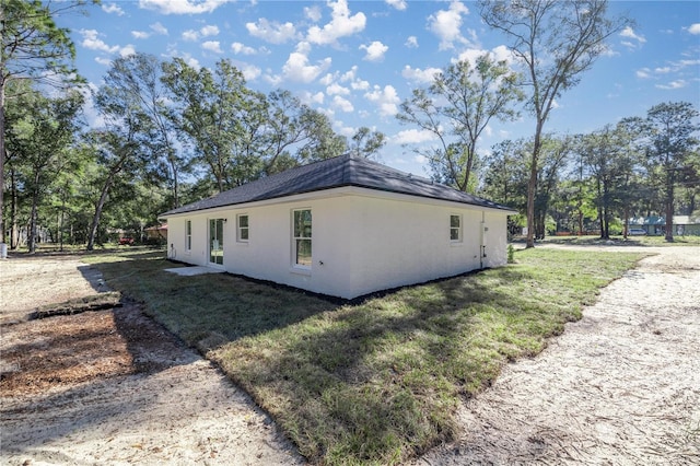 view of home's exterior with a lawn