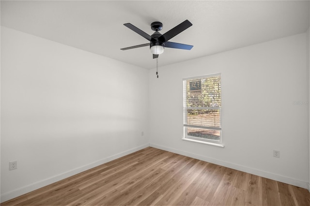 spare room featuring light hardwood / wood-style floors and ceiling fan