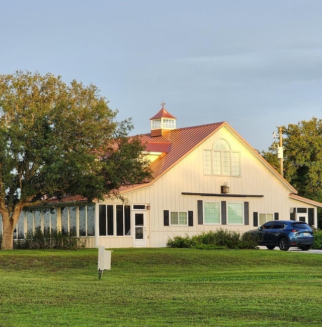 back of property with a yard