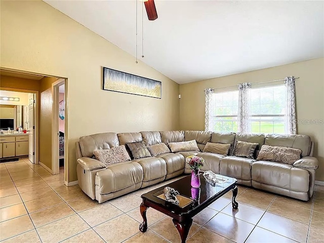 tiled living room with ceiling fan and vaulted ceiling