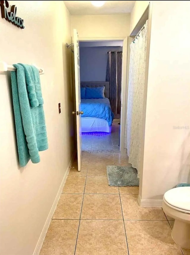 corridor with light tile patterned floors