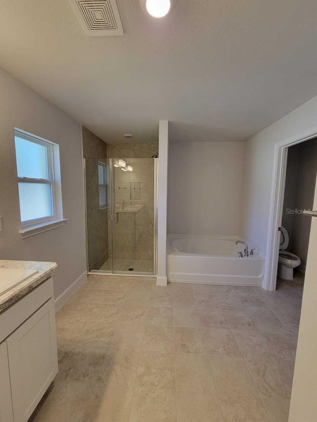 full bathroom featuring toilet, vanity, and shower with separate bathtub